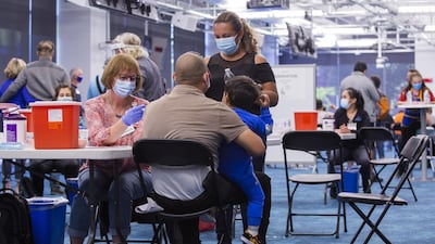 A health care worker administers a dose of the Johnson & Johnson vaccine at the Facebook headquarters in Menlo Park, California. Facebook converted part of its headquarters into a vaccination clinic for under-served communities. Bloomberg