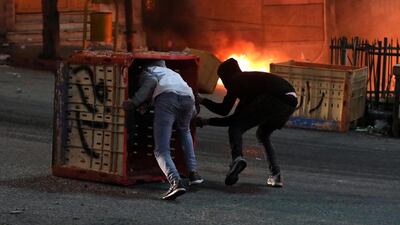 Palestinians throw stones during clashes with Israeli security forces in the wake of a protest against US President Donald J. Trump's Middle East peace plan to solve the conflict between Palestinians and Israel, near the West Bank City of Hebron. EPA