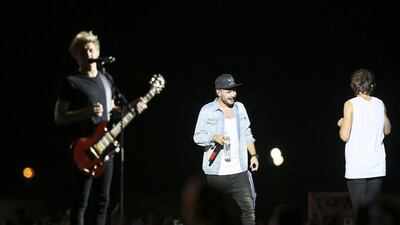 One Direction performs for screaming fans. Sarah Dea / The National