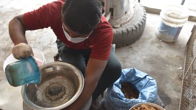 Water is poured into the shredding machine to create a pulp