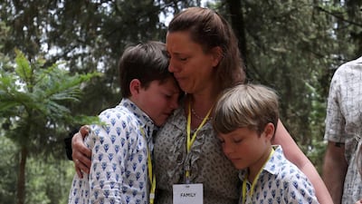 Nadege Dubois-Seex, who lost her husband in the Ethiopian Airlines Flight ET302 and her children attend a memorial ceremony at the French Embassy in Addis Ababa, Ethiopia. Reuters