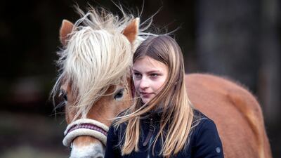 Anni, 13, exercises her Haflinger horse. AP Photo