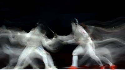 Andrea Baldani of Italy competes against Byungchul Choi of Korea in the Men's Foil Individual Bronze Medal Bout. Lars Baron/Getty Images