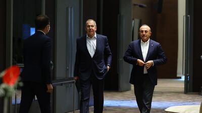 A handout photo made available by Russian Foreign Ministry shows Russian Foreign Minister Sergey Lavrov (C) and Turkish Foreign Minister Mevlut Cavusoglu (R) during their meeting in Antalya, Turkey. EPA