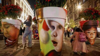 People visit a Christmas display at Zocalo Square in Mexico City. AFP
