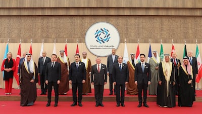 Sheikh Saud, King Abdullah, Jordan's Crown Prince Hussein bin Abdullah, Mr El Sisi, Mr Shia Al Sudani and Mr Macron pose for a family picture after the conference. Reuters