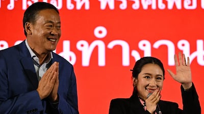 Pheu Thai Party's prime ministerial candidates Paetongtarn Shinawatra, right, and Srettha Thavisin at party headquarters in Bangkok on Sunday. AFP
