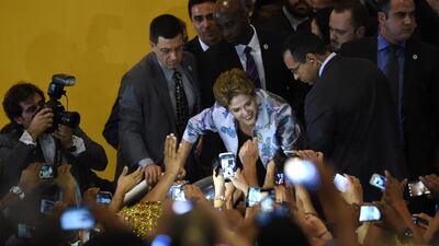 Brazilian President Dilma Rousseff is greeted by participants during the 15th National Health Conference in Brasilia. Brazilian President Dilma Rousseff’s allies appealed to the Supreme Court to block impeachment proceedings, warning of a political “storm” in Latin America’s biggest country. AFP photo