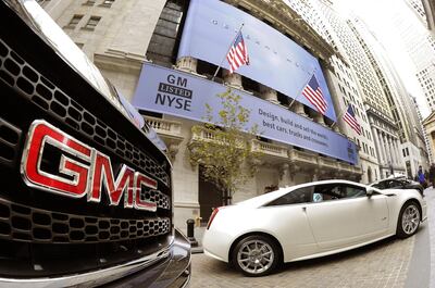 GM cars outside the New York Stock Exchange in New York. AFP