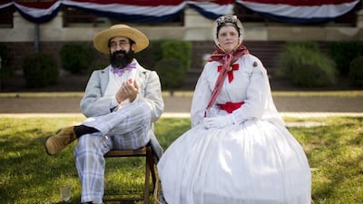 Alex and Sherri Groff of Oaklyn, New Jersey, watch a vintage baseball game during the 2014 Base-Ball Exhibition & Fair at the Navy Yard in Philadelphia. Matt Rourke / AP