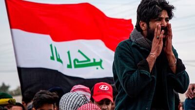 Protesters chant slogans as they march with national flags during an anti-government demonstration, also calling for freedom of the press, in the southern Iraqi city of Basra. AFP