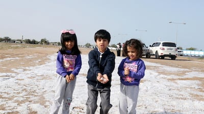 Children play in the hail in Umm Al Quwain. Such conditions are rare but not unheard of in northern areas. Wam