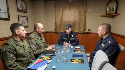 President Vladimir Putin discusses eastern border security on the missile cruiser Varyag, off the coast of Russia's Sakhalin region. EPA