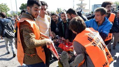 An injured person is caried away following a blast at a peace rally in Ankara on Friday (AFP PHOTO / ADEM ALTAN)