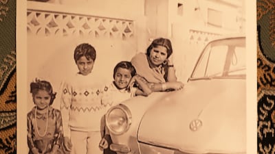 Shaukat (second left) with his family and their Volkswagen car outside their house in Dubai around 1970.