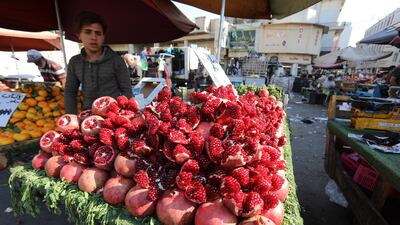 An Iraqi street vendor sells fruit at the Shorjah market in central Baghdad. Inflation in Iraq reached 7.2 per cent in September but is projected to ease in the coming months, according to the IMF. EPA / Ahmed Jalil