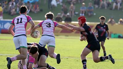 Players in action during the Gulf Under 19 boys cup semi-final 1 match between Dubai College (black) vs S22 UAE Academy.