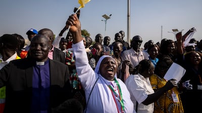 A nun in the crowd shouts that the country needs peace as Pope Francis prepares to leave in his vehicle from the airport. AP