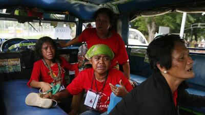 Protesters cry in a jeepney after they were cornered by police dispersing the crowd.