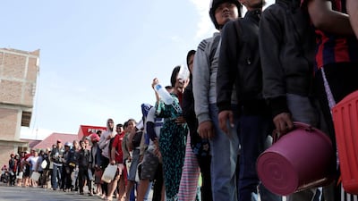 People line up for fuel at a petrol station in Palu, Central Sulawesi, Indonesia. EPA