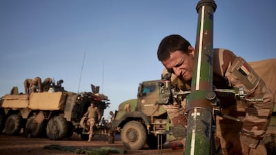 A soldier of the French Army adjusts the coordinates of a mortar ready to be used in Northern Burkina Faso last November. AFP