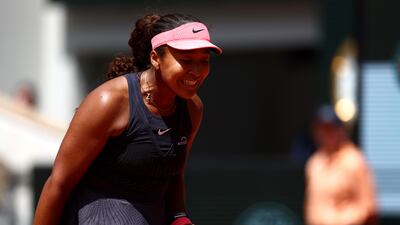 Naomi Osaka celebrates winning a point. Reuters