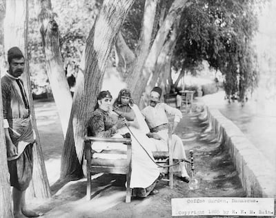 Customers at a coffeehouse on the banks of the Barada in Damascus. Photo: REM Bain, Library of Congress