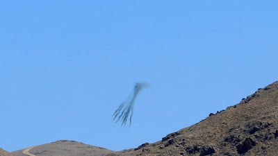 A Lebanese army helicopter is seen firing during the offensive against ISIL in this photo taken from the town of Ras Baalbek on August 19, 2017. Ali Hashisho / Reuters