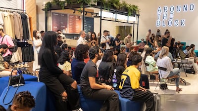 Shoppers watch the performances at The Concept Store.