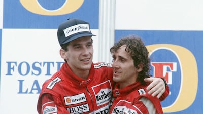 World champion Ayrton Senna (L) of Brazil embraces his team mate and winner of Australian Grand Prix Alain Prost of France , in Adelaide. F1 legend Senna died after crashing at the San Marino Grand Prix in 1994. AFP