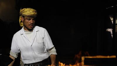 A man prepares kebab for sale at a market in the old quarter of Sana'a, Yemen. EPA