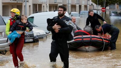 Emergency workers rescue residents from a neighborhood in Trebes after flash floods hit the southwestern Aude district of France. Reuters