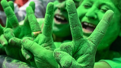 Supporters of the Trinamool Congress Party make the victory sign as they celebrate general election results outside the Chief Minister's residence in Kolkata, West Bengal. AFP