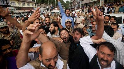 Supporters of Kashmir's main opposition party People's Democratic Party (PDP) shout slogans during a protest in Srinagar. Indian policemen Friday stopped a protest march led by PDP'??s president Mehbooba Mufti against the killings of five Kashmiri civilians in a recent paramilitary firing. Dar Yasin / AP Photo