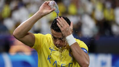 Cristiano Ronaldo pours water over his head during a break in play. Reuters