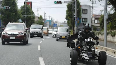 Chibatman rides his Chibatpod on the road.