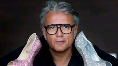 The shoe designer Giuseppe Zanotti with some of his glittering, gravity-defying creations. Jaime Puebla / The National