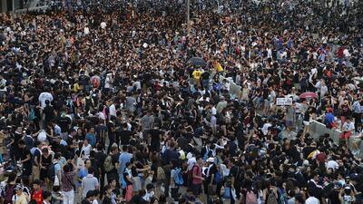Pro-democracy protesters continue to flood the central business district in Hong Kong on Monday, September 29, 2014, defying calls to disperse in a major pushback against Beijing's decision to limit democratic reforms in the former British colobny. Wong Maye-E/AP Photo