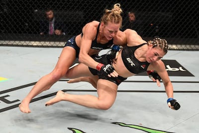 Holly Holm, left, takes down Irene Aldana. Zuffa LLC