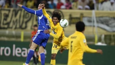 Al Wasl’s Rashed Essa, centre, is outjumped by Al Nasr goalscorer Rodrigo Vergilio, left, last night.
