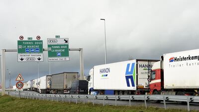 Lorries wait on the A16 motorway to board shuttles at the entrance to the Channel Tunnel site in Calais. AFP