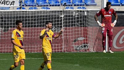 Barcelona's Lionel Messi, centre, celebrates his goal against Alaves. AP Photo