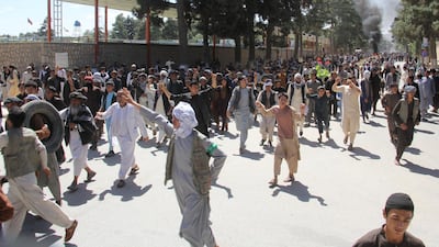 Afghan protesters shout slogans during a protest in Maimana, capital of Faryab province, Afghanistan July 4, 2018. Reuters