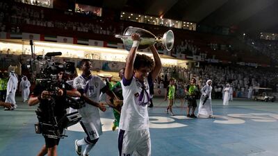 Omar Abdulrahman runs with the President's Cup trophy after Al Ain's victory in the cup over Al Ahli on Sunday. Christopher Pike / The National / May 18, 2014