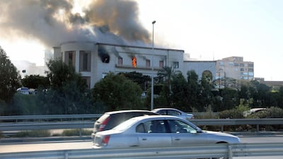 Smoke rises from the site of the headquarters of Libya's foreign ministry after suicide attackers hit in Tripoli. Reuters