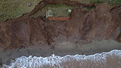 A decommissioned cold war nuclear observation post, the Tunstall ROC bunker, slides from a cliff because of coastal erosion, near Hull in north-east England. AFP