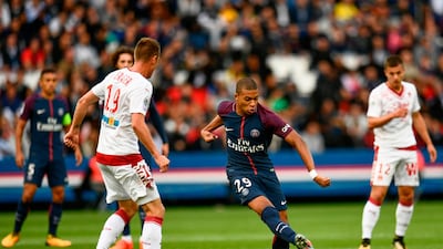Kylian Mbappe, centre, moved from Monaco to Paris Saint-Germain at the beginning of the season. Christophe Simon / AFP