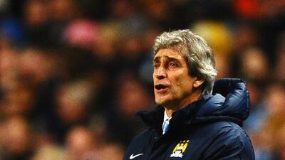 Manchester City manager Manuel Pellegrini reacts during the UEFA Champions League round of 16 first-leg match against Barcelona at the Etihad Stadium on February 18, 2014. Laurence Griffiths / Getty Images