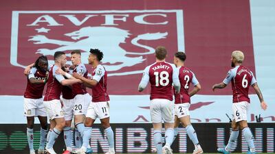 Aston Villa's Bertrand Traore, left, celebrates after scoring. AP