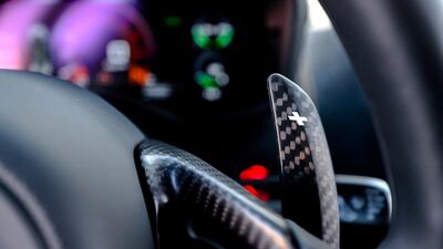 Carbon-fibre paddle shifters and steering-wheel embellishments are among the optional extras offered by McLaren. Victor Besa / The National